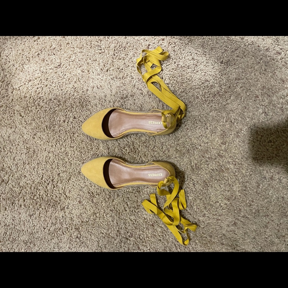 Express yellow shoes wraps around ankle